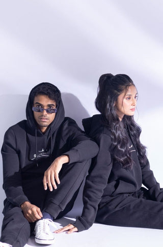 Manto's Unisex Fleece Black Pullover Hoodie with Urdu Manto Logo Paired with Pink Jogger Pants