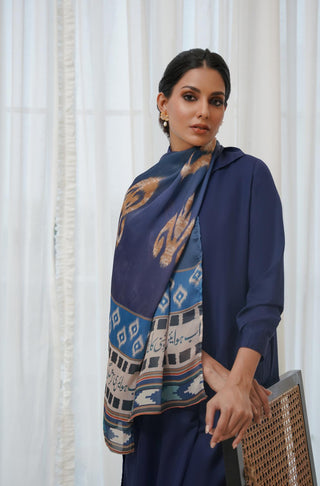 Shopmanto, Pakistani Urdu calligraphy clothing brand, wear Manto ready-to-wear women's Suroor Crinke Silk scarf featuring Mahshar Badayuni's poetry in hijab-friendly design, available in blue and off white.