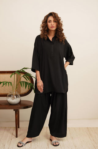 Raya Solid Black Co-ord set is made from ultra-soft wash and wear material featuring short shirt with collar and placket details and shalwar with relaxed fit