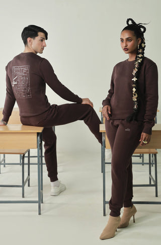 Manto's Unisex Premium Fleece Brown Sanki Sweatshirt featuring Urdu Sanki Motif at the Back Paired with Brown Jogger Pants