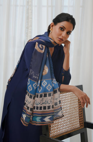 Shopmanto, Pakistani Urdu calligraphy clothing brand, wear Manto ready-to-wear women's Suroor Crinke Silk scarf featuring Mahshar Badayuni's poetry in hijab-friendly design, available in blue and off white.