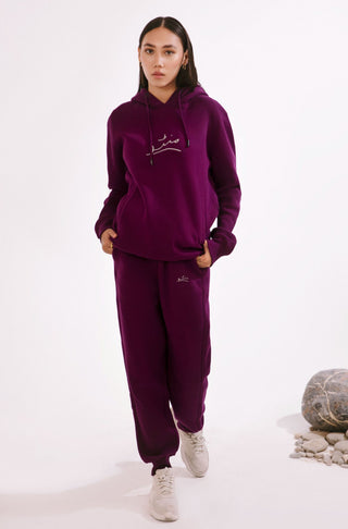 Manto's Unisex Fleece Purple Pullover Hoodie with Urdu Manto Logo Paired with Pink Jogger Pants