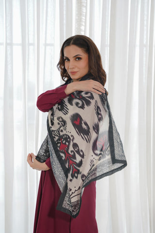 Shopmanto, Pakistani Urdu calligraphy clothing brand, wear Manto ready-to-wear women's Dastoor Swiss Lawn scarf featuring Jigar Moradabadi's poetry in hijab-friendly design, available in black and red.