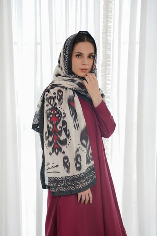 Shopmanto, Pakistani Urdu calligraphy clothing brand, wear Manto ready-to-wear women's Dastoor Swiss Lawn scarf featuring Jigar Moradabadi's poetry in hijab-friendly design, available in black and red.